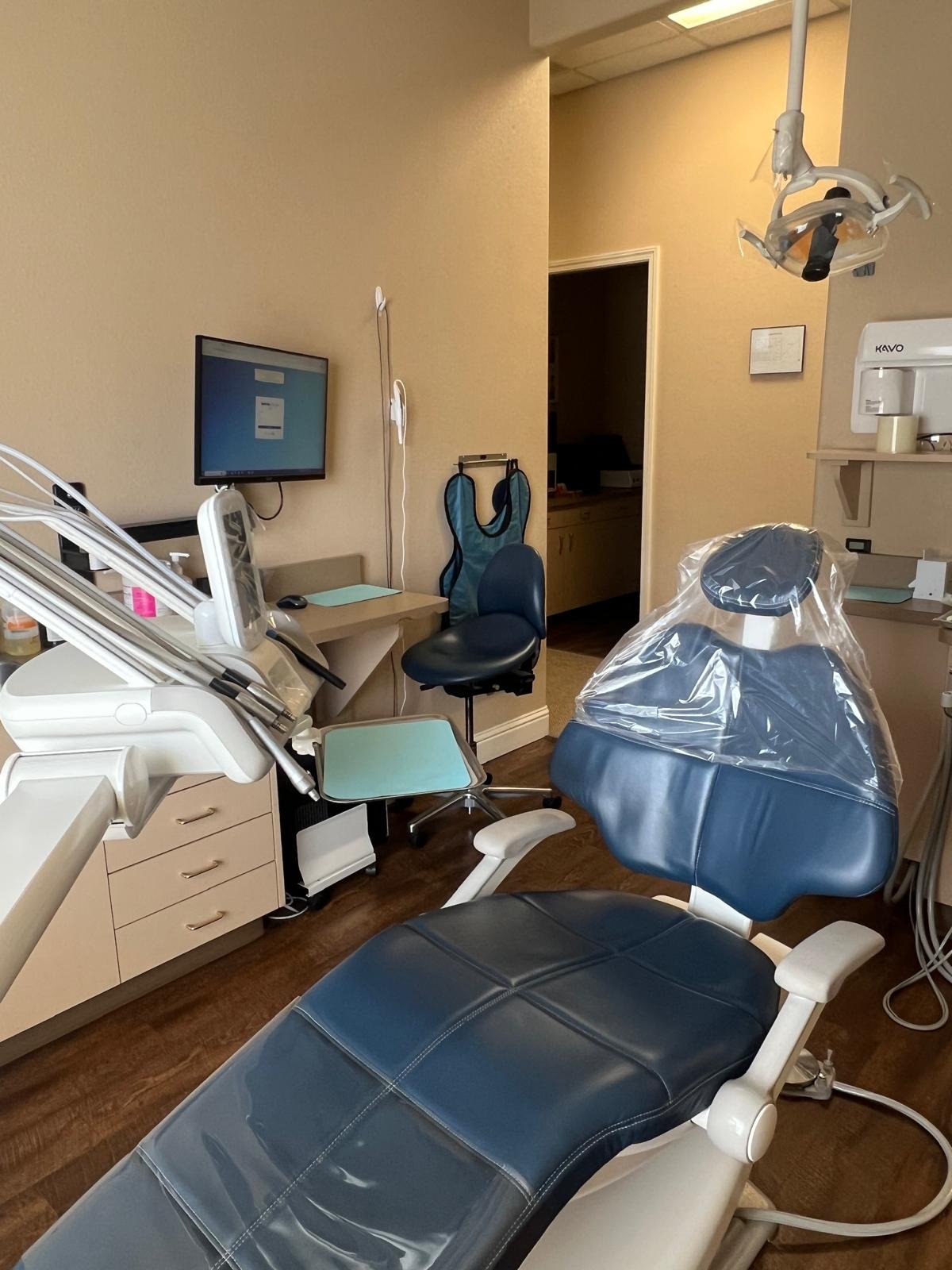 Doctor performing a procedure in the operatory